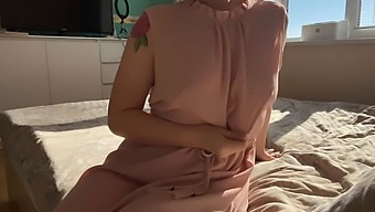 A Woman In A Pink Dress Explores Her Sensuality By Pleasuring Herself