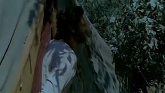 A Married Woman Engages In Sexual Activity With A Black Man While Her Husband Is Nearby, Observed From A Hidden Location